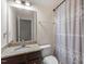 Functional bathroom with granite countertop, vanity, and shower with patterned curtain at 2122 Aventon Ln, Morrisville, NC 27560