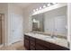 Bathroom featuring a double vanity with granite countertops, offering ample space and style at 2122 Aventon Ln, Morrisville, NC 27560