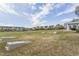 Expansive green lawn in a community with cornhole boards and a picnic pergola, perfect for recreation at 2122 Aventon Ln, Morrisville, NC 27560