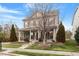 Charming two-story home with inviting front porch and manicured lawn at 2122 Aventon Ln, Morrisville, NC 27560
