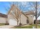 Attached two-car garage with a paved driveway and manicured landscaping at 2122 Aventon Ln, Morrisville, NC 27560