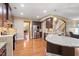 Open-concept kitchen boasts stainless steel appliances, granite countertops, and dark wood cabinets at 2122 Aventon Ln, Morrisville, NC 27560