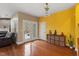 Bright living room featuring hardwood floors, French doors, and a cozy sitting area at 2122 Aventon Ln, Morrisville, NC 27560