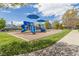 Blue playground with slides and climbing structures set in a community park, perfect for outdoor fun at 2122 Aventon Ln, Morrisville, NC 27560