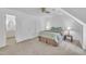 Bedroom with neutral carpet and adjoining bathroom at 2204 Basil Drive, Raleigh, NC 27612