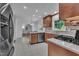 Spacious kitchen with wood cabinets, stainless steel appliances, and tiled floor at 2204 Basil Drive, Raleigh, NC 27612