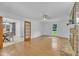 Open concept living room with fireplace, wood floors, and abundant natural light at 2204 Basil Drive, Raleigh, NC 27612