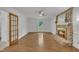 Living room with fireplace and mantel, wood floors, and lots of natural light at 2204 Basil Drive, Raleigh, NC 27612