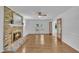 Spacious living room with a brick fireplace, wood floors, and natural light at 2204 Basil Drive, Raleigh, NC 27612