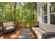 Relaxing backyard deck with ample seating, offering a serene and private outdoor living space at 228 Grantwood Dr, Holly Springs, NC 27540