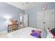 Sunlit bedroom with a desk, a ceiling fan, and a cozy tiger themed decor at 228 Grantwood Dr, Holly Springs, NC 27540
