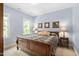 Inviting bedroom with a wooden bed, patterned quilt, and bedside tables offering a cozy and stylish retreat at 228 Grantwood Dr, Holly Springs, NC 27540