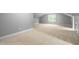 Versatile bonus room features neutral carpet, natural light, and architectural details at 228 Grantwood Dr, Holly Springs, NC 27540