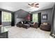 Cozy bonus room features comfortable seating and modern decor, perfect for relaxation and entertainment at 228 Grantwood Dr, Holly Springs, NC 27540