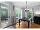 Dining area with lots of natural light and views of the outdoor deck at 228 Grantwood Dr, Holly Springs, NC 27540