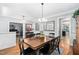 Well-lit dining area with hardwood floors, spacious table, and modern accents at 228 Grantwood Dr, Holly Springs, NC 27540