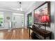 Elegant foyer with hardwood floors, a stylish table, and a beautifully decorated entrance at 228 Grantwood Dr, Holly Springs, NC 27540