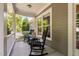 Relax on the charming front porch with rocking chairs and a view of the well-maintained landscaping at 228 Grantwood Dr, Holly Springs, NC 27540