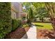 Charming home exterior with manicured landscaping and a covered porch, creating curb appeal at 228 Grantwood Dr, Holly Springs, NC 27540