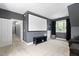 Home theater boasts a large screen, comfortable seating, and dark gray painted walls for immersive viewing at 228 Grantwood Dr, Holly Springs, NC 27540