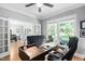 Bright and spacious office featuring a large desk, comfortable seating, and natural light at 228 Grantwood Dr, Holly Springs, NC 27540