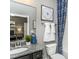 Bathroom with granite countertop, undermount sink, and a combined tub and shower at 2516 Del Webb Gardens Dr, Fuquay Varina, NC 27526