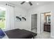 Bright bedroom featuring a large window and walk-in closet, open to the bathroom at 2516 Del Webb Gardens Dr, Fuquay Varina, NC 27526