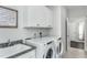 Laundry room with sink, and two appliances at 2516 Del Webb Gardens Dr, Fuquay Varina, NC 27526