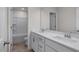 Spacious bathroom with dual sinks, white cabinetry and a walk-in shower at 267 Old Fashioned Way, Lillington, NC 27546