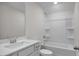 Bright bathroom with combination tub and shower at 267 Old Fashioned Way, Lillington, NC 27546