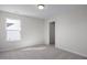 Bright, carpeted bedroom featuring a window and closet at 267 Old Fashioned Way, Lillington, NC 27546