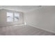 Brightly lit bedroom featuring plush carpet and large windows at 267 Old Fashioned Way, Lillington, NC 27546