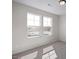 Sunlit bedroom with two large windows allowing ample natural light at 267 Old Fashioned Way, Lillington, NC 27546