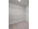 Walk-in closet with wire shelving and neutral carpet at 267 Old Fashioned Way, Lillington, NC 27546