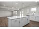 Spacious kitchen with stainless steel appliances, a central island, and an open layout at 267 Old Fashioned Way, Lillington, NC 27546