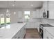 Modern kitchen with a large island, stainless steel appliances, and ample counter space at 267 Old Fashioned Way, Lillington, NC 27546