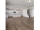 Open concept living space with hardwood floors, recessed lighting, and a view of the kitchen at 267 Old Fashioned Way, Lillington, NC 27546