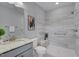 Modern bathroom featuring a walk-in shower with stylish gray and white tile at 3020 High Plains Dr, Fuquay Varina, NC 27526