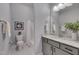 Well-lit bathroom featuring a granite countertop, gray cabinets, and a shower and tub combination at 3020 High Plains Dr, Fuquay Varina, NC 27526