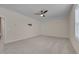 Spacious bedroom features neutral carpeting, a ceiling fan, and natural light at 3020 High Plains Dr, Fuquay Varina, NC 27526