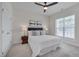Cozy bedroom featuring neutral carpet, a ceiling fan and natural light from a window at 3020 High Plains Dr, Fuquay Varina, NC 27526