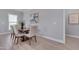 Dining area features a modern table, chairs, and ample natural light at 3020 High Plains Dr, Fuquay Varina, NC 27526