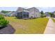 Beautiful home exterior with a screened-in porch, green lawn, and tasteful landscaping at 3020 High Plains Dr, Fuquay Varina, NC 27526