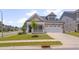 Charming home with a covered front porch, well-manicured lawn, and two-car garage at 3020 High Plains Dr, Fuquay Varina, NC 27526