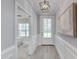 Hallway leading to a back door with views into a bedroom at 3020 High Plains Dr, Fuquay Varina, NC 27526