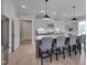 Spacious kitchen with bar stool seating, stainless steel appliances, and wood floors at 3020 High Plains Dr, Fuquay Varina, NC 27526