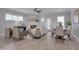 Open living and dining area features a fireplace, neutral decor, and abundant natural light at 3020 High Plains Dr, Fuquay Varina, NC 27526