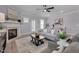 Bright living room boasts modern decor, fireplace, and wood-look flooring at 3020 High Plains Dr, Fuquay Varina, NC 27526