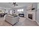 Cozy living room with a fireplace and a comfortable seating arrangement at 3020 High Plains Dr, Fuquay Varina, NC 27526