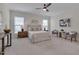 Bright main bedroom featuring plush carpeting, neutral decor, and ample natural light at 3020 High Plains Dr, Fuquay Varina, NC 27526